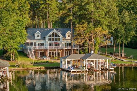 Luxury lake house dreams do come to life at 54 Stonecrop Circle. This rare offering features 6037 square feet, 4 bedrooms, 3 flex rooms, 5 full, & 1 half bath spread across 3 levels. Upscale & timeless features include: Pella windows w/ built in blin...