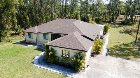 Don't miss the opportunity to buy this beautiful, spacious, and bright home on half acre lot available in Lehigh Acres! open-concept floor plan, and large square tile flooring makes the kitchen and living room a perfect place for entertaining. This l...