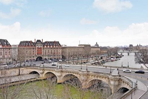 On Quai des Orfèvres, a stone's throw from the Pont Neuf bridge and the left bank, an elegant, 341 sq.m., south-facing townhouse commanding a spectacular view of the river, renovated in great style and featuring 7 floors connected via elevator and a ...
