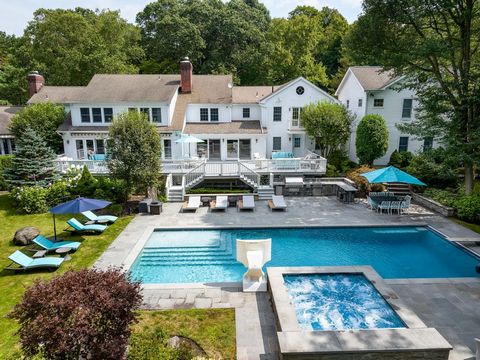 Experience refined luxury and casual elegance in this exquisite home located amidst the serene Whippoorwill neighborhood of Armonk. Lush and private, the 2+ acre property is set behind gates that are a picturesque backdrop to a private oasis. The ame...