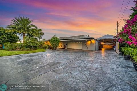 Welcome to this remarkable waterfront residence in the sought-after Harbor Villages of Pompano Beach. Featuring 3BR and 2.5BA, meticulously remodeled, showcasing high-quality finishes including: One of a kind enormous tiki-bar fully equipped with hug...