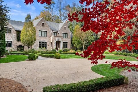 Nestled at the end of a tranquil lane in the prestigious enclave, the Paces Civic Association, on the West side of Buckhead, this meticulously crafted custom estate spans over 2.1 acres of lush, level grounds. Designed by the renowned architects Harr...