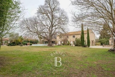 Close to Eyguières and the Alpilles massif, discover this property situated on a 3.7 acre plot. With a living space of approximately 2900 sqft, this residence offers a quiet living environment. The main building, formerly a farmhouse, has been meticu...