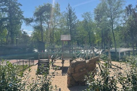 This beautiful chalet is located close to all facilities of this beautiful, wooded holiday park on the Veluwe. From the accommodation you have a perfect view of this beautiful nature through the large windows. The modern design provides a beautiful a...