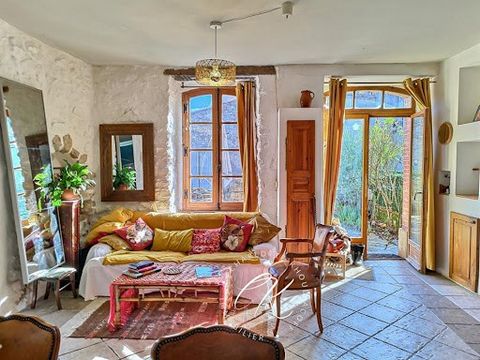 Lovers of nature and old stones, come and discover this atypical property full of charm in the heart of a pretty flowery village, a stone's throw from all amenities. An authentic living environment combined with an ideal space to carry out your proje...