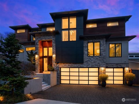 Discover the pinnacle of luxury living in West Seattle. This 2018 built custom home boasts awe-inspiring Puget Sound and Olympic Mountain views from every level, and offers a well thought out floor plan for comfortable, modern living. Ideal for enter...