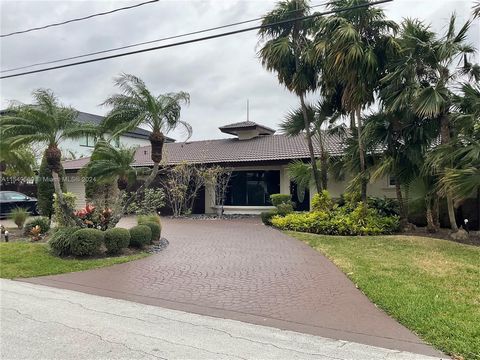 Presenting a rare gem in the highly sought-after Coral Ridge neighborhood. This waterfront home with a 100-ft dock offers an exceptional opportunity for development or renovation. Embodying the perfect blend of location and potential, this property i...