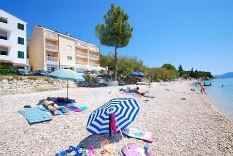Great apartment house with 16 apartments in an attractive position, on the first row by the sea and a beautiful beach in the town of Podaca/Gradac, ideal for a pleasant family vacation. A 5 km long footpath/promenaderuns along the coast for those who...