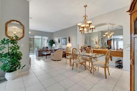 MAJESTIC ISLES--SUPER ACTIVE ADULT COMMUNITY. CLOSE TO PLACES OF WORSHIP. WOW! What a unique and more significant model Villa, with only two in the entire community. The house trim is made of concrete, ensuring your safety during the hurricane season...