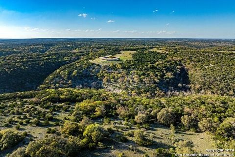 Escape to Nopalitos Medina Mountain Ranch-138.5 acres of unspoiled, unrestricted beauty. Enjoy panoramic vistas from the expansive covered veranda of the main residence, a modern sanctuary spanning 3855 sf. Exuding contemporary elegance with plank fl...
