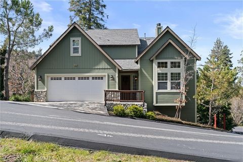 This Beautiful home is situated in the Arrowhead Canyon community of Lake Arrowhead. Enter the main level of the home with hardwood floors, throughout the home. Dual sided fireplace separates two family rooms on main floor with open concept dining ro...