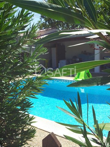 Maison de 220m2 avec son jardin de 1640 m2, sa piscine, sa cuisine d'été et sa dépendance de 36m2 .