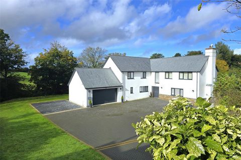 This individually designed home sits prominently down a herringbone design block paviour drive offering parking for a dozen or so vehicles. The colour washed rendered elevations are offset by Anthracite coloured double glazing all under slate roof. B...