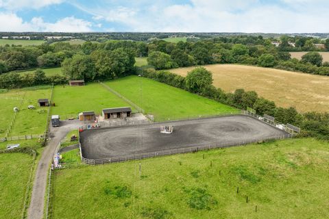 A characterful two bedroom barn conversion with superb equestrian facilities and approximately 1.7 acres of land in a private location within the Buckinghamshire village of Great Kingshill. The property is situated in open countryside with far reachi...