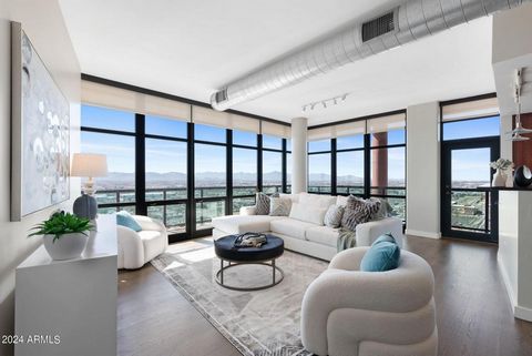 Indulge in urban luxury on the 21st floor of a meticulously maintained downtown Phoenix building. This unit offers unobstructed city and mountain views from every room. Modern design and opulent finishes create a seamless living space flooded with na...