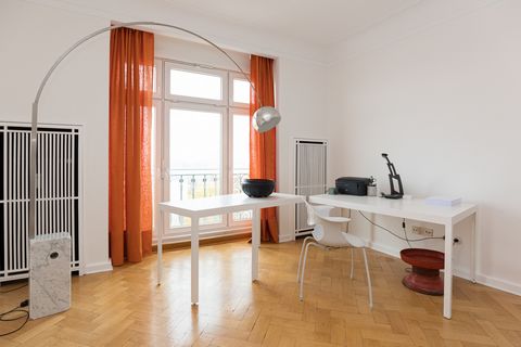 Apartment on the 10th floor of a famous GDR landmark building on Strausberger Platz with views over Berlin. The one bedroom apartment is flooded with light. The living room has a desk for home office and a sofa for relaxing. The kitchen is open to th...