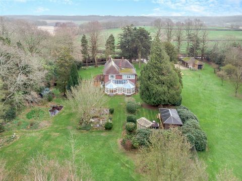 GUIDE PRICE £1,400,000 - £1,500,000 We are pleased to offer to the market this rare opportunity to purchase this property set on 2.7 acres which is made up of two halves. The substantial five bedroom detached house that sits in a proud position withi...