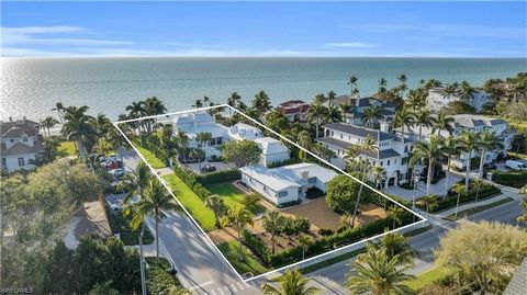 Step onto the white, sandy beach from your own Naples beach compound, a legacy property comprised of two homes that is perfect for multigenerational gatherings. Combining a 6-bedroom, 6.5-bath primary residence and a 3-bedroom, 2-bath secondary resid...