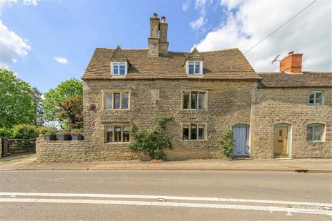 In the middle of a small and pretty, linear village, in a Conservation Area, stands a handsome, grade II listed house which offers 4 to 5 bedrooms, 2 reception rooms and a large kitchen breakfast room. A generous, mature garden with a terrace, drivew...