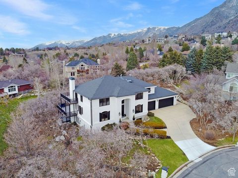 Welcome to this stunning home nestled on Sandy's East Bench, where luxury meets comfort on a serene 1/2 acre lot tucked away in a quiet cul-de-sac. This remarkable property offers unparalleled access to nature with world-class ski resorts, recreation...