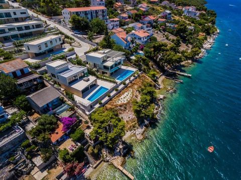 Wonderful villa just 90 meters from the sea within new modern villas community on Ciovo! Exceptional sea views and views over Trogir and Seget! Total area is 332 sq.m. Land plot is 698 sq.m. This exclusive villa also delights with its modern architec...