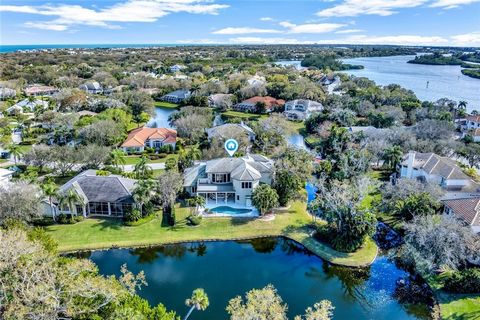 Over 350 ft of lake frontage including a small peninsula makes this 4BR/4BA home one of a kind! This home boasts a grand entrance w/ high ceilings, dining rm, open kitchen w/ center island, double ovens & eat-in area opening to family rm. Split bedro...