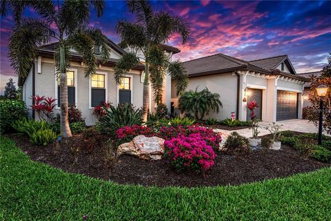 Step into a serene oasis where luxury meets leisure—an oversized screened lanai beckons with the allure of al fresco dining amidst panoramic views of the 4th and 5th fairways of the exclusive Arnold Palmer designed golf courses. Indulge in the opulen...