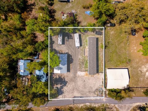 Introducing an incredible investment opportunity! This large double homesite in with an extremely well kept 2022 modular home on one lot and a huge pole barn on the other. The current owner has added a large front porch entry to the home that makes f...