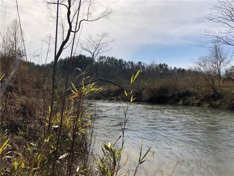 Build your dream cabin retreat or cabins in this super rare, 30.14 acre parcel with 450 ft of Ellijay River frontage and Cashes Valley Views.Cleared path to the top for 360 degree mountain views. Surveyed and marked, sale includes 2.24 acre parcel ad...