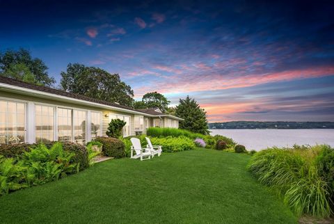 Timeless 0.6-acre waterfront property situated on a bluff commanding full western view of Three Mile Harbor. The well cared for three bedroom, three bath house is a custom build on two levels. The main level includes primary suite with vanity station...