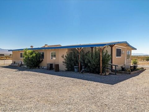 Experience the serenity of nature at 6901 Mountain View Ave, Pahrump, NV 89060. This charming **756 sqft 2-bedroom, 2-bath home** sits on 2.5 acres, offering ample privacy on the far north side of Pahrump. With an additional **520 sqft guest house**,...