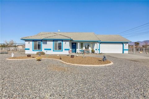 This beautiful one-story home is located on a corner lot cul-de-sac street in Pahrump, offering plenty of space with its 1-acre lot. It features 3 bedrooms and 2 full bathrooms, perfect for comfortable living. The home boasts vaulted ceilings and a k...