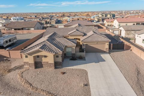 This sophisticated smart home in the highly desirable Petroglyph Estates (where no two homes are alike) is perfectly designed for entertaining and comfort; bright, airy and spacious! The kitchen has soft-close cabinetry, granite counters, and a wine ...