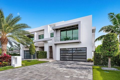 Experience unparalleled luxury and contemporary design in this stunning Transitional Modern townhome, perfectly situated just two blocks from the pristine beachfront.Step through an impressive grand pivot entry door into a foyer that sets the stage f...