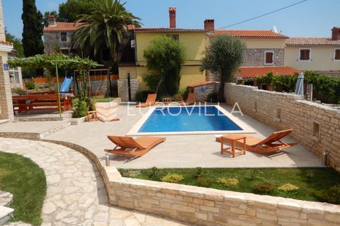 For sale is a holiday house located in Ližnjan, only 800 m from the sea, ideal for a family holiday or investment. It consists of two almost identical apartments, situated on the ground floor and first floor. Each apartment has a living room with a k...