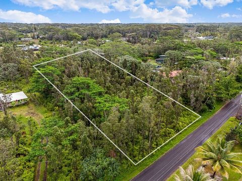 This Ohia-lined one acre lot in Hawaiian Paradise Park is ready to clear and build your dream home! Situated on 13th avenue, off of Makuu Drive, this lot appears to have few Albizia trees and many native Ohia, with High-speed internet connectivity av...