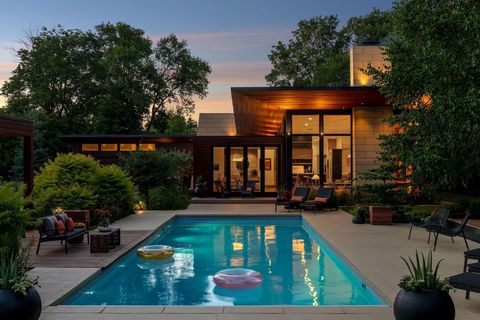 Incredibly private hilltop setting, nestled on the edge of Theodore Wirth Park and overlooking downtown Minneapolis' skyline. This David Strand-designed modern masterpiece is brimming with mid-century particulars and offers unparalleled attention to ...