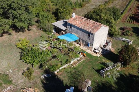 In the vicinity of the town of Labin we have agricultural land of 27,000 m2 with an old stone house for renovation. The house has connections to water and electricity, water is indented in the olive grove. As for the electricity leased is 9.9 kw/h. T...