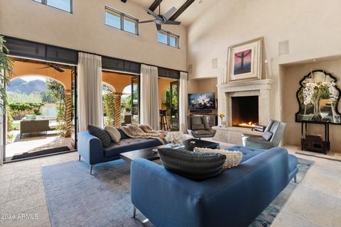 Professionally designed by Taddey Karlin of Beverly Hills & nestled in the foothills of the iconic Camelback Mountain, this impeccably maintained residence exudes timeless elegance. One of only nine (9) south positioned Ultra-premium lots & the LARGE...