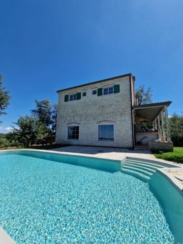 A beautiful stone house with a sea view in Porec with distant sea views! Total area is 200 sq.m. Land plot is 781 sq.m. The house boasts a well-designed layout spread across two floors. The ground floor features a spacious living room with direct acc...