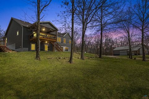 Welcome to your slice of paradise! Situated on nearly 13 acres of scenic beauty, this real estate gem is a dream come true. Boasting not just one, but two homes, the possibilities are endless. The second home serves as a versatile space, ideal for re...