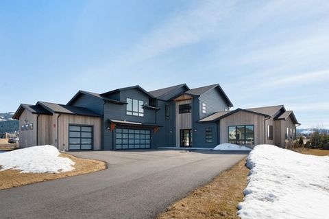 Nestled in the picturesque landscape of Bozeman, where the majestic Gallatin, Bridger, and Spanish Peaks Mountain ranges paint the horizon, sits this exquisite sanctuary of modern luxury. Located in the esteemed custom home enclave of Home 40 in SE B...