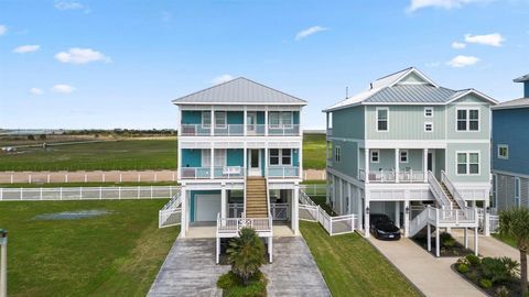 Modern luxury meets coastal charm in this stunning custom home with impressive GULF VIEWS! Every day feels like a seaside escape, with large windows & decks on each level to embrace the sea air & unobstructed beach views. Main level offers fantastic ...