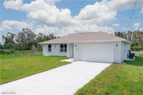 Welcome to your dream home in Lehigh Acres! This stunning new construction residence is nestled in the heart of one of Florida's most desirable communities. Boasting modern design and luxurious upgrades, this property offers the perfect blend of comf...