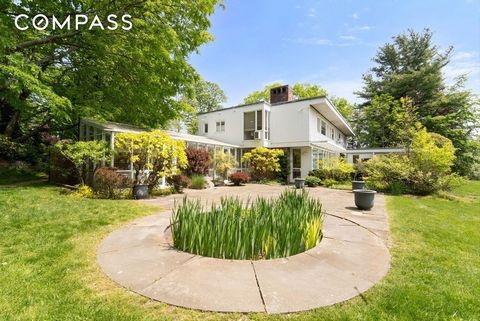 A rare and unique opportunity to make this 1950s International Style Modern home with private tennis court your very own estate. Sited on 1.78 acres of lush grounds, mature trees, and stairs that lead to your very own secret garden. Add your own crea...