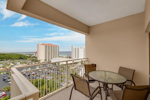 Experience breathtaking beach-to-bay vistas from this 9th-floor, northeast corner condo in Luau II. Featuring a wrap-around covered balcony, this unit offers stunning panoramic views. With a versatile lock-off floor plan, it can function as a studio,...