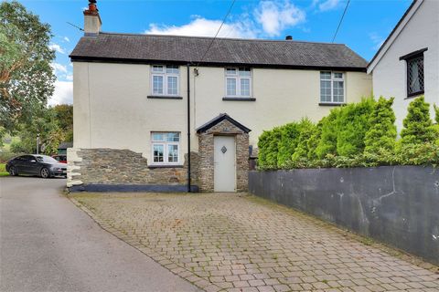 This charming property blends character with modern comforts, creating an ideal family home with a remarkable history as a successful holiday let. The entrance features a delightful stone storm porch, leading into a welcoming hall with slate flagston...