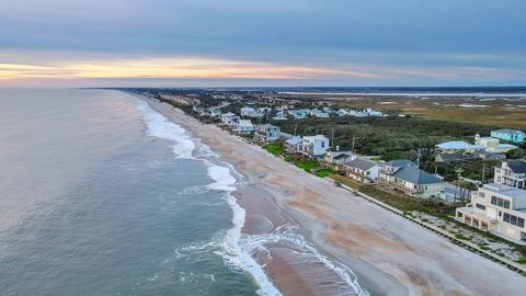 Florida beach cottage charm with spectacular sunrises and expansive ocean views welcomes in the sun with an open floorplan, vaulted ceilings and wall of windows to soak in the panoramic seascape. This optimal four bedroom floorplan features two bedro...