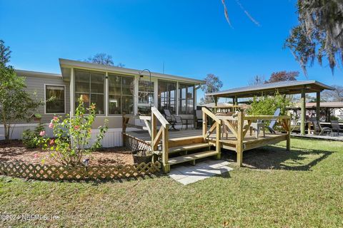 This Remodeled (2018) Double Wide (Homes of Merit) is in Immaculate condition w/ approximately 150 Ft on the water! Very private w/ amazing views! Minutes to the St Johns River. Huge lot - sellers Boat & enclosed trailer fits next to the workshop! Bo...