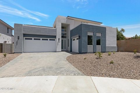 Final Opportunity TIVOLI CLOSEOUT-Last home at Tivoli! TIVOLI at Spectrum is Gilbert's only Luxury Modern Contemporary NEW BUILDS! EST Completion: May 2024. The Vaerdier Model is a breathtaking 4432 SF , 5 bed , 4.5 bath , Loft , 3 CG , 2-Story , Cor...